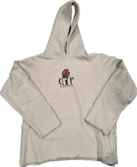 a white hoodie with a rose on it